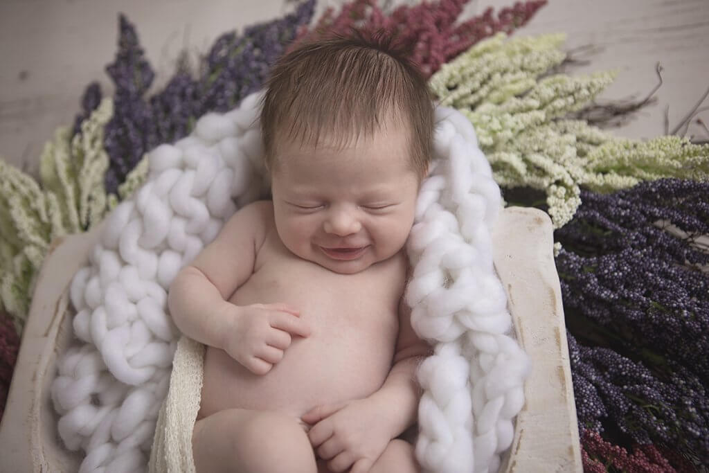 newborn smiles chunky white blanket winter florals