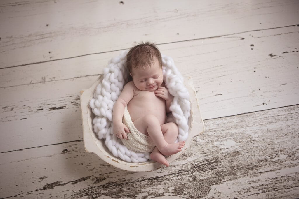 newborn evelyn smiles