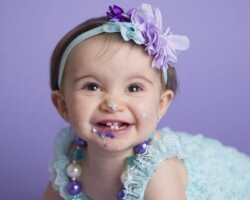 purple frosting face cake smash