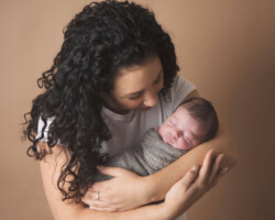newborn in moms arms
