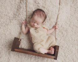newborn in swing