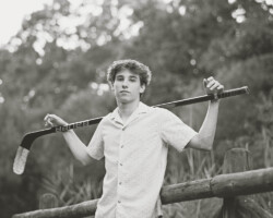 High school senior posing outdoors in Barrington, RI during a fall senior portrait session with Fallon Photographic Art