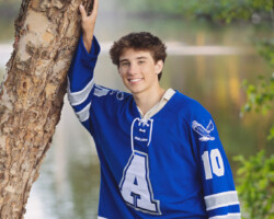 High school senior posing outdoors in Barrington, RI during a fall senior portrait session with Fallon Photographic Art