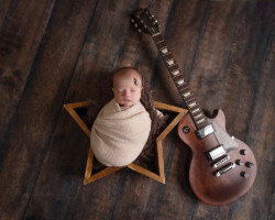 Newborn baby girl with guitar